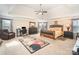 Spacious main bedroom with tray ceiling, carpeting, and a sitting area for relaxation at 2605 Lakefront Dr, Belmont, NC 28012