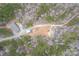 Aerial view of property with home, outbuildings, surrounding trees and land at 2647 Dusty Trail Ln, Lancaster, SC 29720