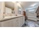 Bathroom featuring double sink vanity and soaking tub at 2647 Dusty Trail Ln, Lancaster, SC 29720