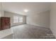 This bedroom has neutral walls, plush carpet and a window that allows for natural light at 2647 Dusty Trail Ln, Lancaster, SC 29720