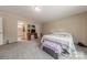 Bright bedroom features carpet and natural light from the window at 2647 Dusty Trail Ln, Lancaster, SC 29720