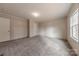 Bright, spacious bedroom features neutral walls, plush carpet, and a window for natural light at 2647 Dusty Trail Ln, Lancaster, SC 29720