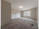 Spacious bedroom with neutral carpet and natural light from the window at 2647 Dusty Trail Ln, Lancaster, SC 29720