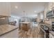 Kitchen island features a light countertop and wood floors flow through the open floor plan at 2647 Dusty Trail Ln, Lancaster, SC 29720