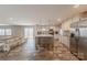 Spacious kitchen with stainless appliances, white cabinets, center island, and dining area at 2647 Dusty Trail Ln, Lancaster, SC 29720