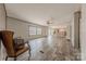 Airy living room features wood floors and large windows for natural light at 2647 Dusty Trail Ln, Lancaster, SC 29720