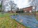 Backyard view featuring a garden and partial view of the home's exterior brickwork at 3021 Whitson Rd, Gastonia, NC 28054