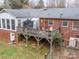 Backyard view featuring a deck and partial view of the home's exterior brickwork at 3021 Whitson Rd, Gastonia, NC 28054