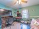 Cozy bedroom featuring desk, wall-mounted TV, and natural light from the window at 3021 Whitson Rd, Gastonia, NC 28054