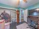 Bedroom with hardwood floors, a ceiling fan, natural light from the windows, and unique decorations at 3021 Whitson Rd, Gastonia, NC 28054