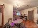 Dining area with a round table, chairs, chandelier and hardwood floors at 3021 Whitson Rd, Gastonia, NC 28054