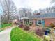 Charming brick home with green shutters, landscaped yard, and inviting walkway at 3021 Whitson Rd, Gastonia, NC 28054