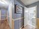 Hallway with wainscoting leading to a bathroom and other rooms in the home at 3021 Whitson Rd, Gastonia, NC 28054