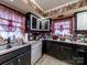 Kitchen with red curtains, appliances, and backsplash at 3021 Whitson Rd, Gastonia, NC 28054