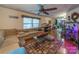 Cozy living room featuring a ceiling fan, hardwood floors, and a comfortable sectional sofa at 3021 Whitson Rd, Gastonia, NC 28054