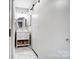 Bathroom featuring a modern vanity, round mirror, and sliding barn door at 3224 Heathstead Pl, Charlotte, NC 28210