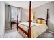 Cozy bedroom with four poster bed, carpet and a desk near a window with natural light at 3224 Heathstead Pl, Charlotte, NC 28210