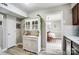 A charming dining area is viewed from the kitchen, next to a white hutch at 3224 Heathstead Pl, Charlotte, NC 28210