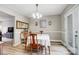 The dining area features neutral walls, attractive wood floors, and a modern light fixture at 3224 Heathstead Pl, Charlotte, NC 28210