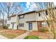 Exterior view of a charming townhouse, showcasing a well-maintained front yard and a freshly painted exterior at 3224 Heathstead Pl, Charlotte, NC 28210