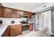 An efficient kitchen features stainless steel appliances and tile backsplash at 3224 Heathstead Pl, Charlotte, NC 28210