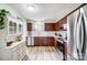 Bright kitchen featuring stainless steel appliances, wood cabinets, and white subway tile backsplash at 3224 Heathstead Pl, Charlotte, NC 28210