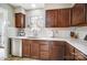 Well-lit kitchen featuring wooden cabinets, stainless steel appliances, and a bright window with white subway tile backsplash at 3224 Heathstead Pl, Charlotte, NC 28210