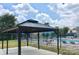 Outdoor pool with surrounding lounge chairs and shaded gazebo is perfect for relaxing at 3224 Heathstead Pl, Charlotte, NC 28210