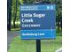 Street sign reads Little Sugar Creek Greenway at Heidleburg Lane near Mecklenburg County Park and Recreation at 3224 Heathstead Pl, Charlotte, NC 28210