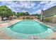 Community swimming pool surrounded by lounge chairs, perfect for relaxation and recreation at 3504 Colony Rd # R, Charlotte, NC 28211