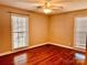 Empty bedroom featuring hard wood floors and windows at 3580 5Th Ne St, Hickory, NC 28601