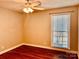 Bedroom with wood floors, ceiling fan, and window at 3580 5Th Ne St, Hickory, NC 28601