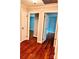 Hallway with hardwood floors and multiple doors leading to bedrooms at 3580 5Th Ne St, Hickory, NC 28601