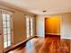 Bright living room with gleaming hardwood floors and glass doors, creating a warm and inviting atmosphere at 3580 5Th Ne St, Hickory, NC 28601