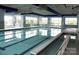 Bright indoor pool with lap lanes and large windows for natural light creating a tranquil aquatic environment at 41062 Calla Lily St, Fort Mill, SC 29707