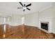 Spacious living room with hardwood floors, fireplace and ceiling fan; perfect for entertaining at 41062 Calla Lily St, Fort Mill, SC 29707