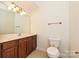 Bright bathroom with a vanity with a sink, mirror and a toilet at 4709 Polo Gate Blvd, Charlotte, NC 28216