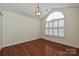 Well-lit bedroom with hardwood floors and a large window with white shutters at 4709 Polo Gate Blvd, Charlotte, NC 28216