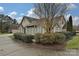 Charming home with stone accents, neat landscaping, and a curved driveway at 4709 Polo Gate Blvd, Charlotte, NC 28216