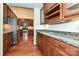 Kitchen with modern stainless steel appliances, granite counters, and hardwood floors at 4709 Polo Gate Blvd, Charlotte, NC 28216