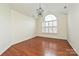 Inviting living room with hardwood floors and a large window at 4709 Polo Gate Blvd, Charlotte, NC 28216