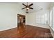 Bright sun room with hardwood floors, neutral walls, ceiling fan, and abundant natural light at 4709 Polo Gate Blvd, Charlotte, NC 28216