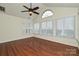 A spacious sun room with hardwood flooring, large windows and classic white shutters at 4709 Polo Gate Blvd, Charlotte, NC 28216