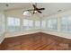 Bright sun room filled with natural light, hardwood flooring, and many windows at 4709 Polo Gate Blvd, Charlotte, NC 28216