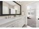 Bathroom with double vanity and large mirror at 5608 Closeburn Rd, Charlotte, NC 28210