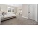 Neutral bedroom with soft carpet, a ceiling fan and seating at 5608 Closeburn Rd, Charlotte, NC 28210