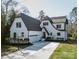 Charming home featuring a basketball hoop, a well-manicured lawn and black trimmed windows at 5608 Closeburn Rd, Charlotte, NC 28210