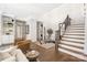 Inviting foyer with hardwood floors, a beautiful staircase, and stylish decor at 5608 Closeburn Rd, Charlotte, NC 28210