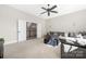 Bright living room features a large grey couch and access to the home's second story at 5608 Closeburn Rd, Charlotte, NC 28210