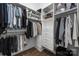 Spacious closet with custom shelving, hanging rods, and a black basket for storage solutions at 5608 Closeburn Rd, Charlotte, NC 28210